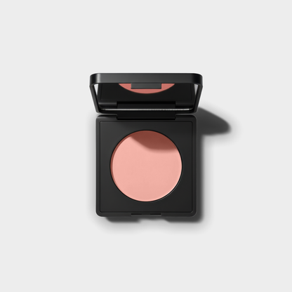 Luminance Milano Under-Eye Brightener compact, open, on a grey background