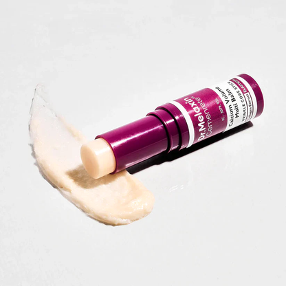 Multi-Balm stick beside a swatch of the balm, on a grey background